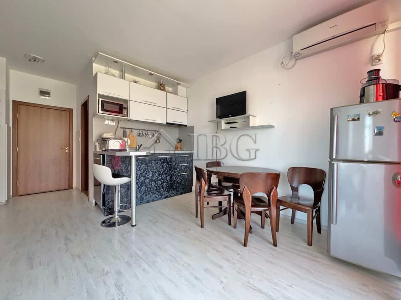 Interior view of a ground-floor two-bedroom apartment in Sunny Beach with modern kitchen and dining.