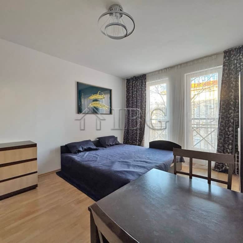Bright studio apartment near Sunny Beach with modern furnishings and large windows.