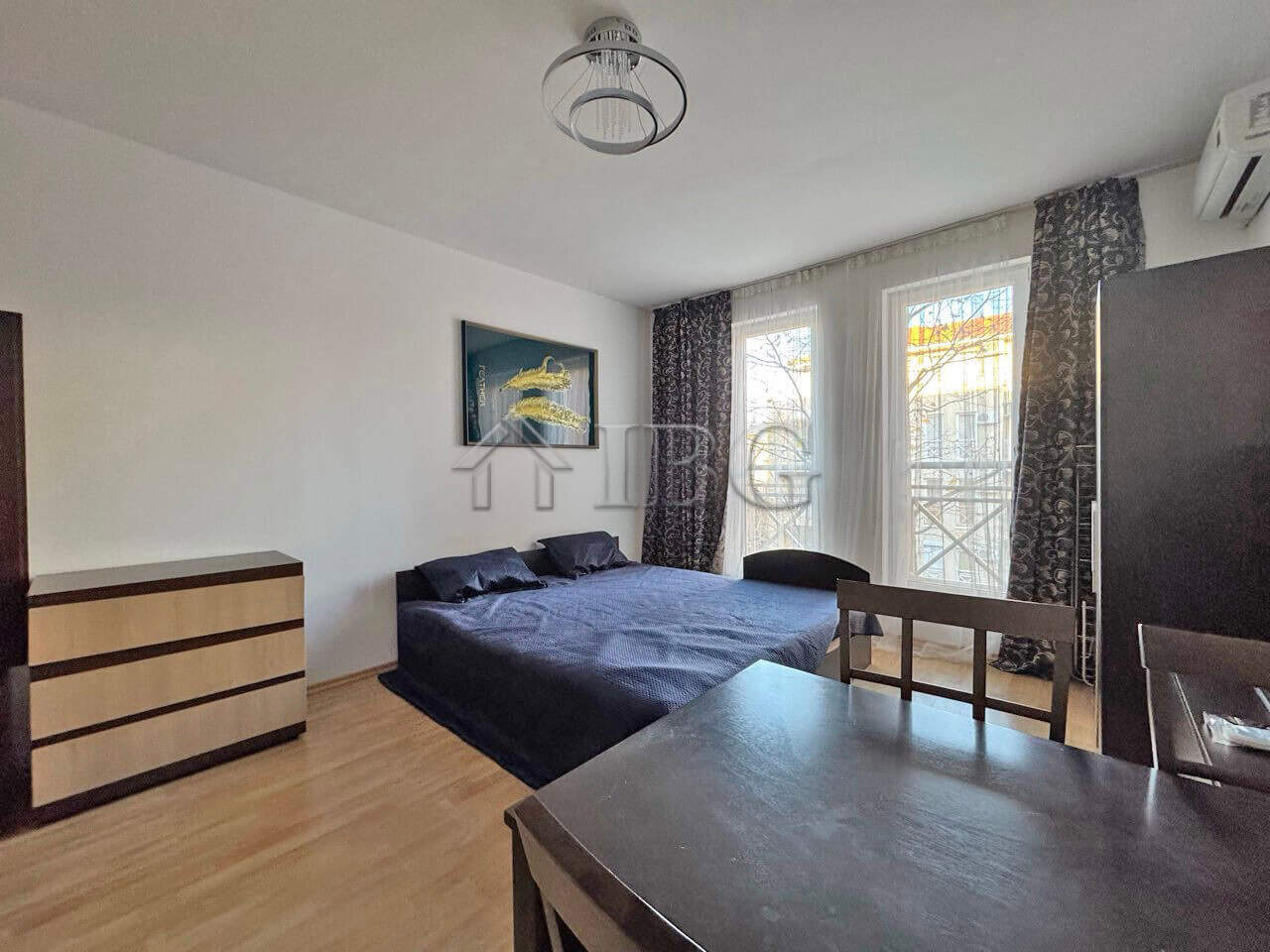Bright studio apartment near Sunny Beach with modern furnishings and large windows.