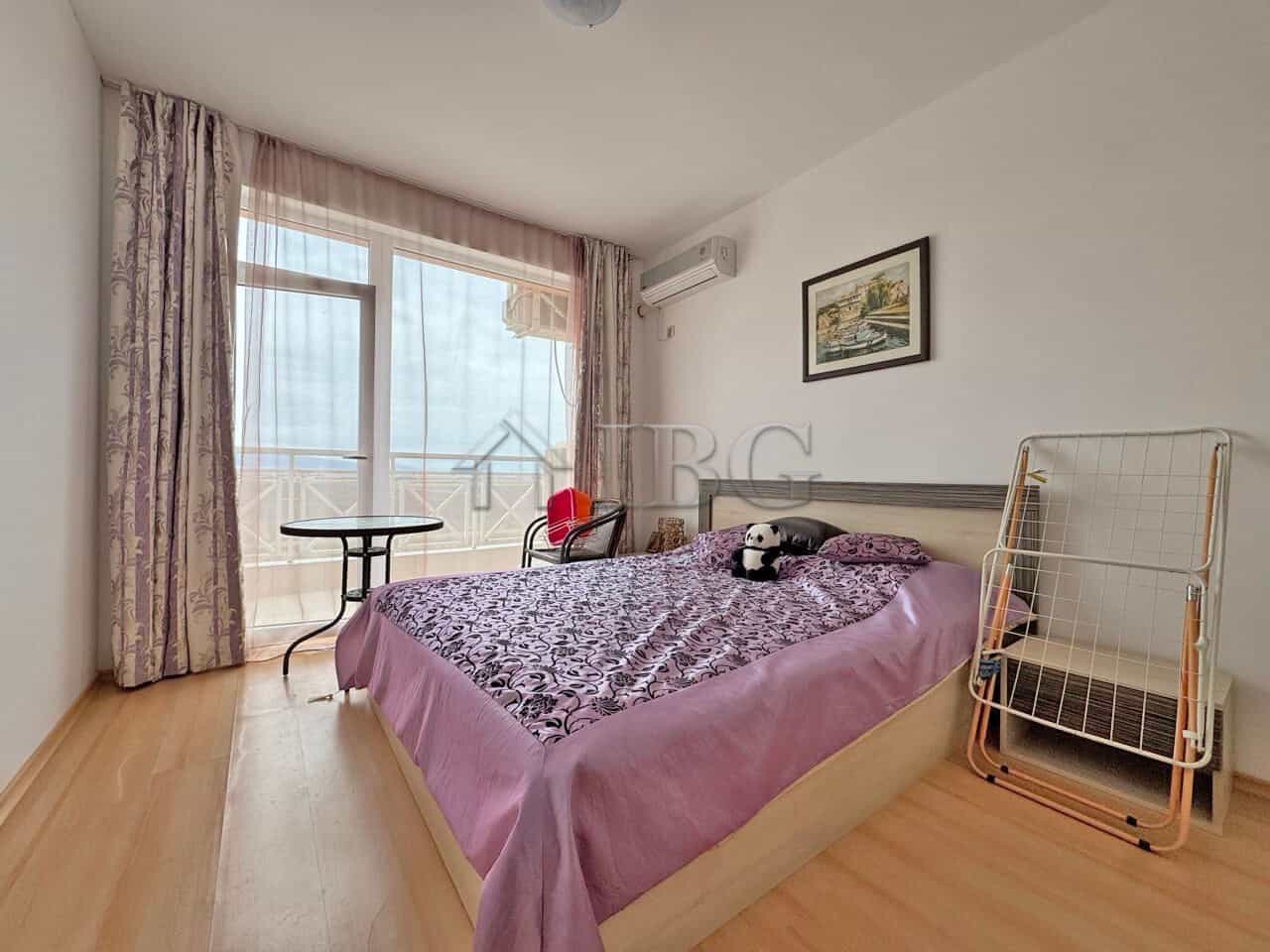 Bright 1-bedroom apartment with balcony overlooking sunny beach and panoramic sea views.
