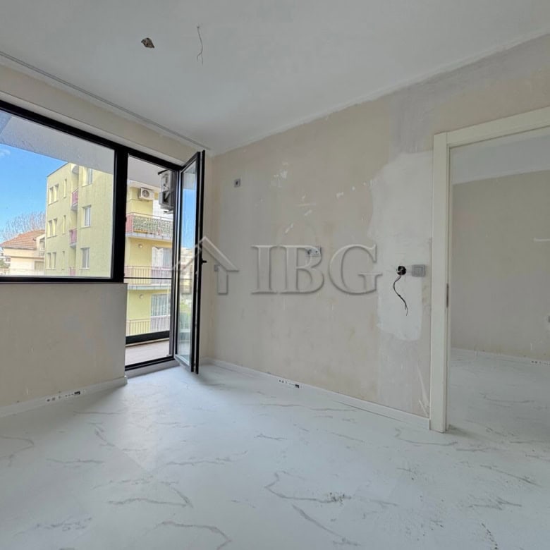 Bright, unfurnished one-bedroom apartment with large windows in Sunny Beach, Bulgaria.