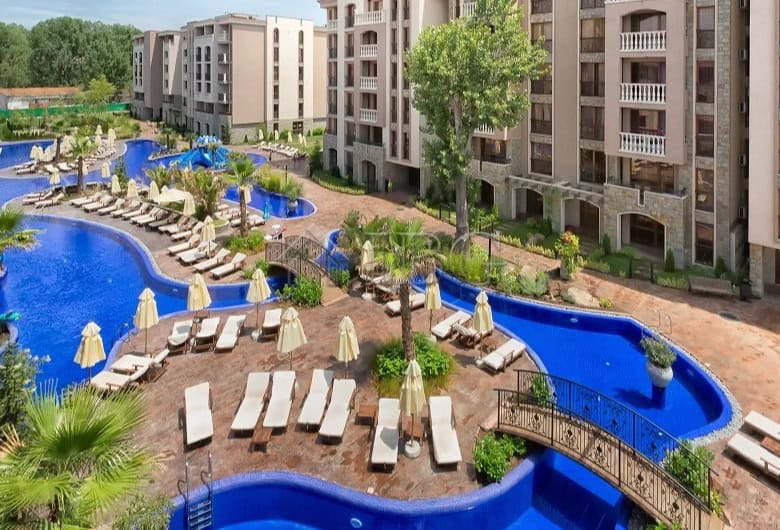 Luxurious 1-bedroom apartment at Cascadas Family Resort, Sunny Beach, with pools and garden views.