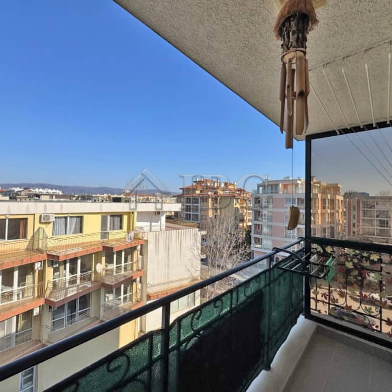 Cozy furnished studio with balcony overlooking Sunny Beach skyline.