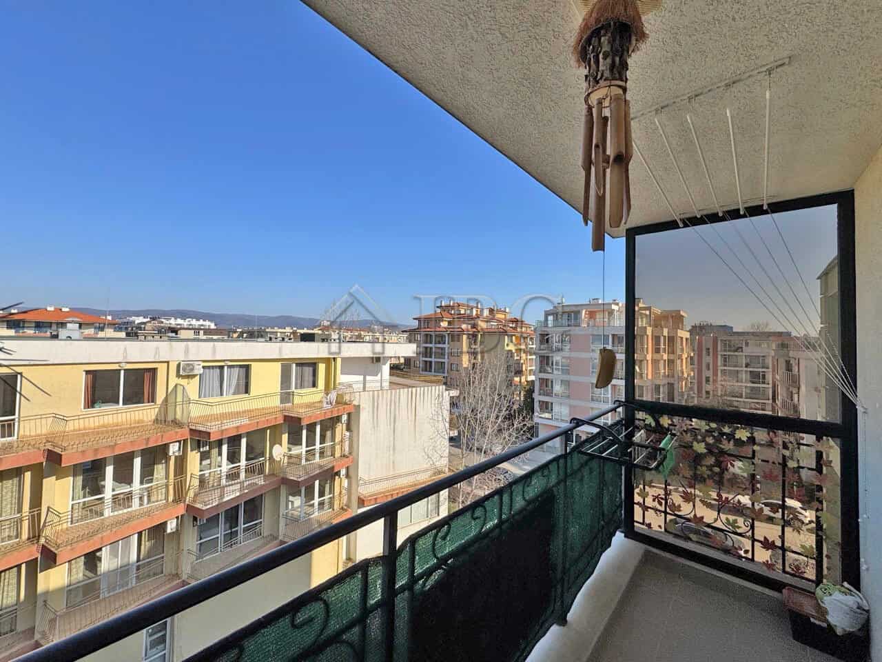 Cozy furnished studio with balcony overlooking Sunny Beach skyline.