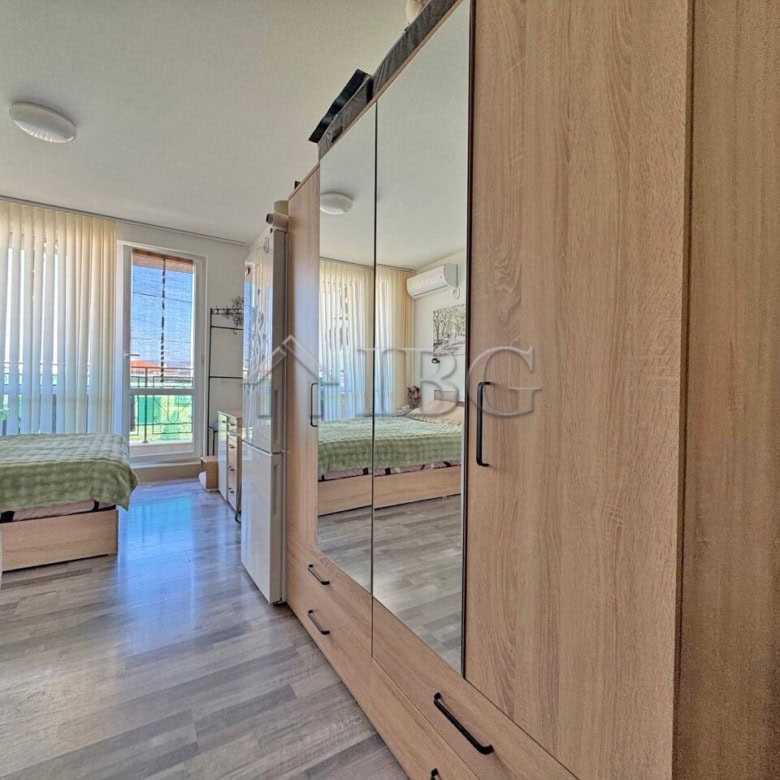 Furnished studio with balcony in Topoli Complex, Sunny Beach, offering modern living space and sceni.