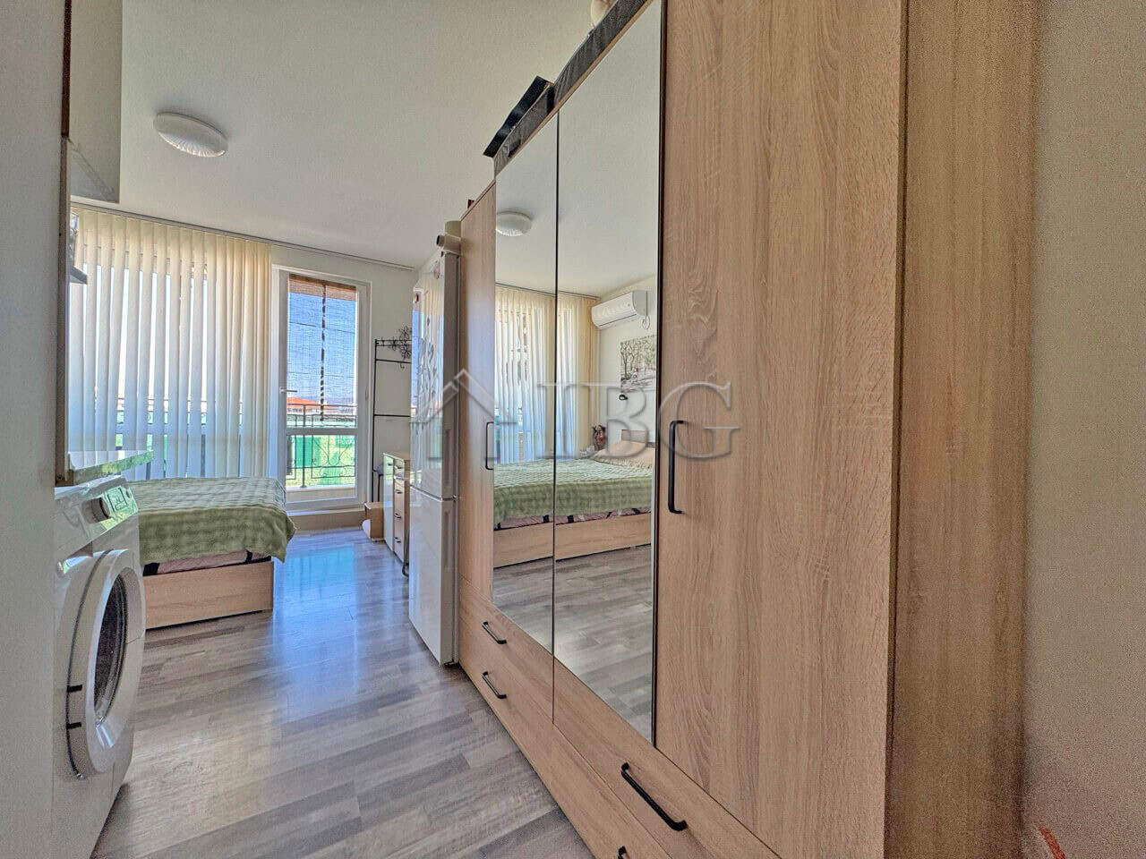 Furnished studio with balcony in Topoli Complex, Sunny Beach, offering modern living space and sceni.