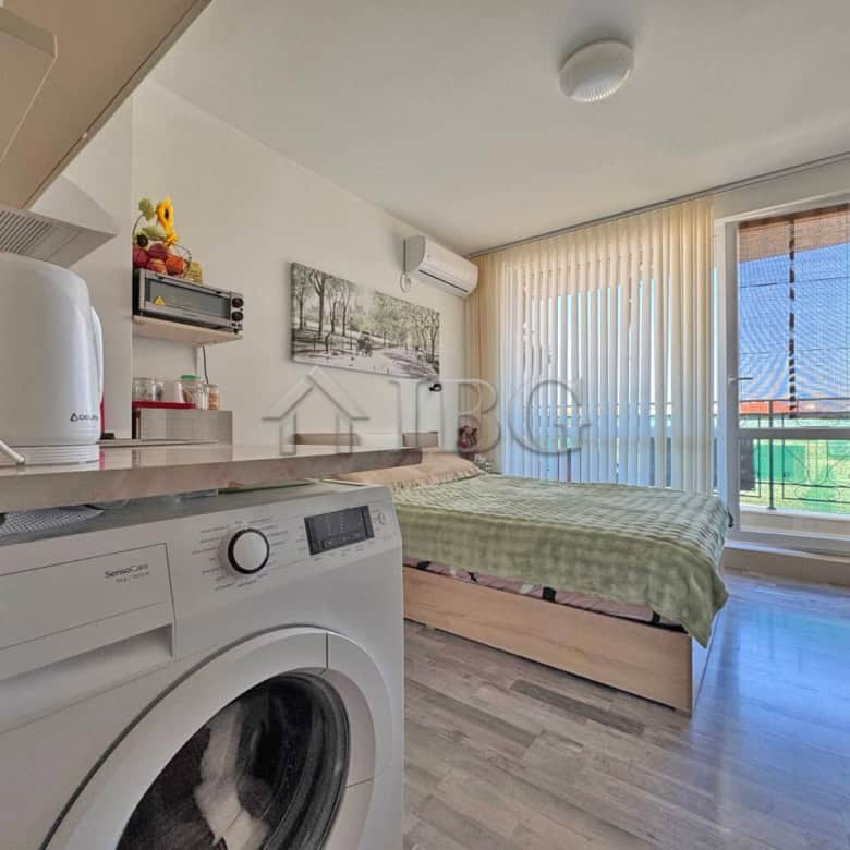 Furnished studio apartment with balcony, modern amenities, and scenic views in Topoli Complex, Sunny.