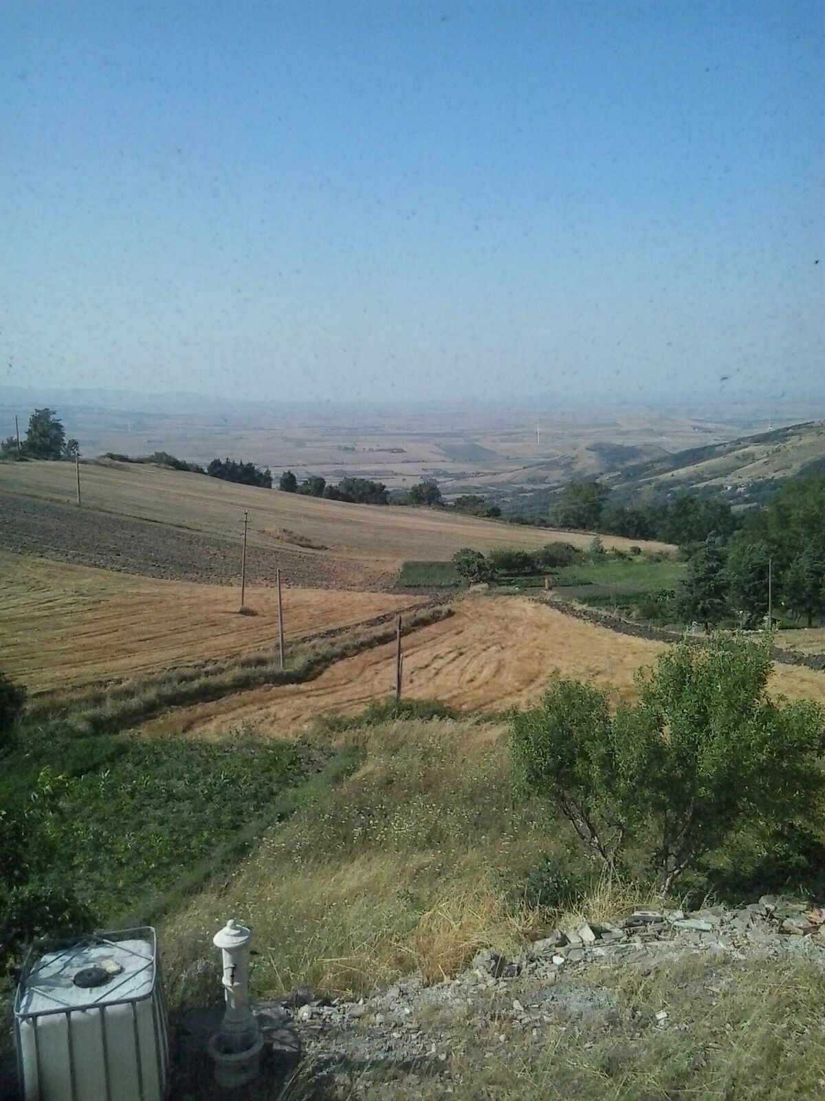 Scenic view of rolling hills and farmland in Orsara di Puglia, Italy, ideal for countryside living o.