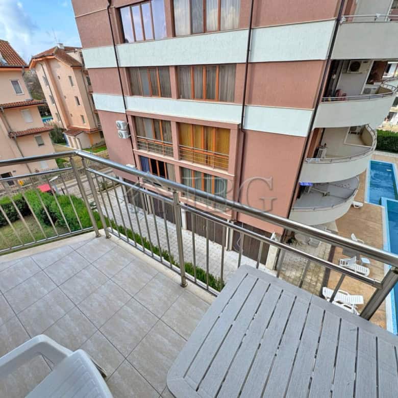 Apartment with balcony overlooking pool in Sunny Beach.