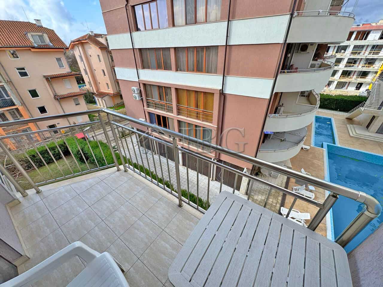 Apartment with balcony overlooking pool in Sunny Beach.