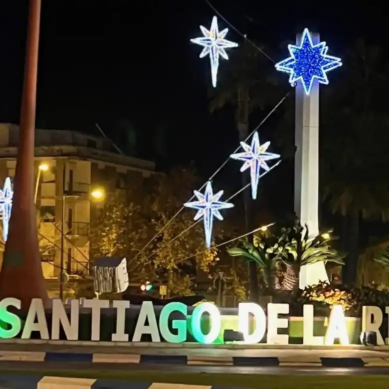 Bright night view of Santiago de la Ribera with illuminated stars and welcoming atmosphere.
