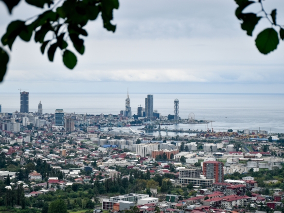 Batumi, Georgia Scenic aerial view of Batumi cityscape and the Black Sea with modern architecture and lush greenery.